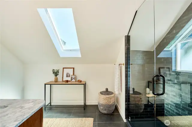 Primary en-suite with gorgeous architectural details and heated tile flooring.