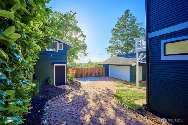 Expansive driveway leads to studio and large 2-car garage with plenty of off-street parking - a rare amenity in Seattle.