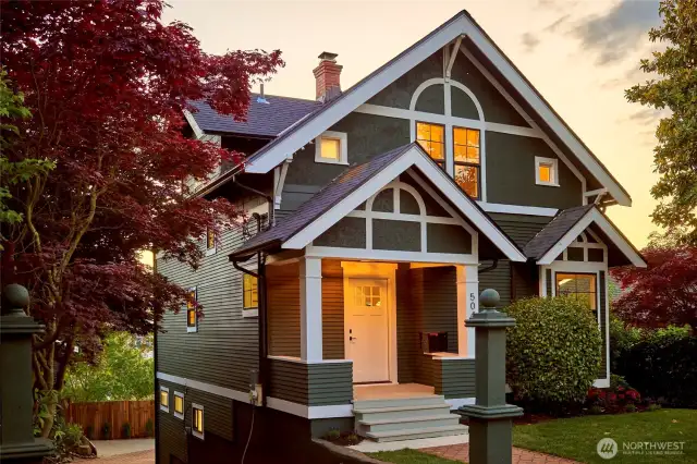 Stately Craftsman home perched high overlooking western sunset and Cascade Mountain views.