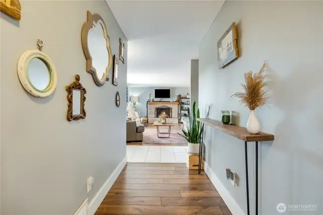 A strikingly wide hallway effortlessly links the living room to the bedrooms, adding a spacious, airy flow that enhances the home’s open, inviting vibe.