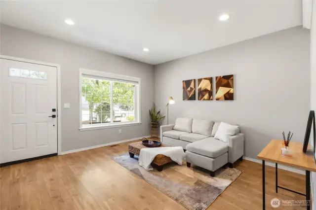 Beautiful open living room welcomes you at the front door.