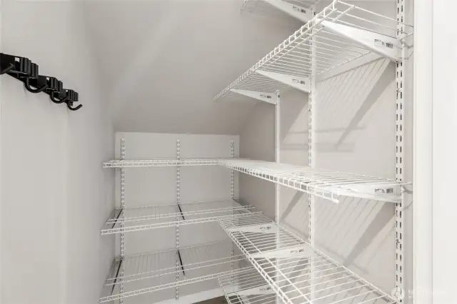Walk-in pantry next to kitchen.