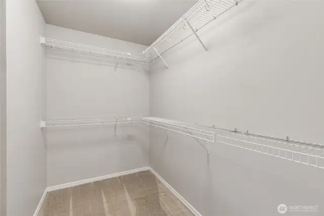 Walk-in closet in primary bedroom.