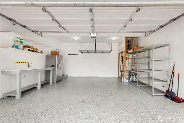 Epoxy flooring, over-head storage, work bench and 2nd fridge stays.