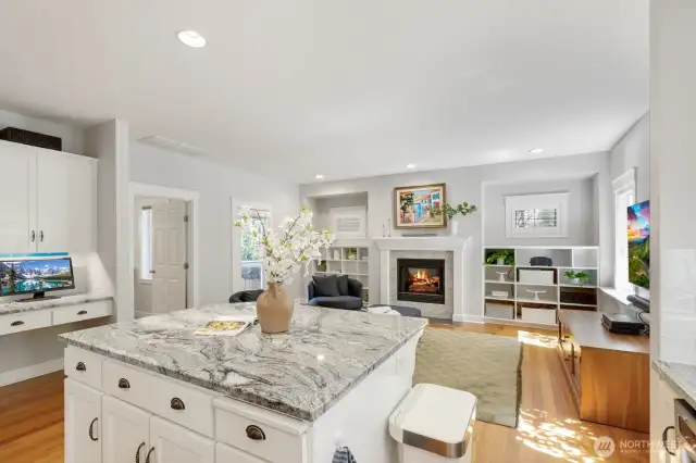 Bonus room off of kitchen with tile fireplace