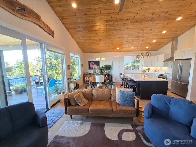 Great Room Concept with large windows and sliding glass doors
