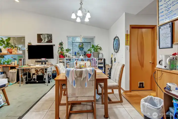 Perfect eat in kitchen/dining room area on pristine ceramic tile floor.