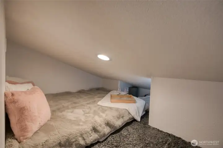 And the other half of the loft is currently in use as the sleeping quarters.  A cozy nest!