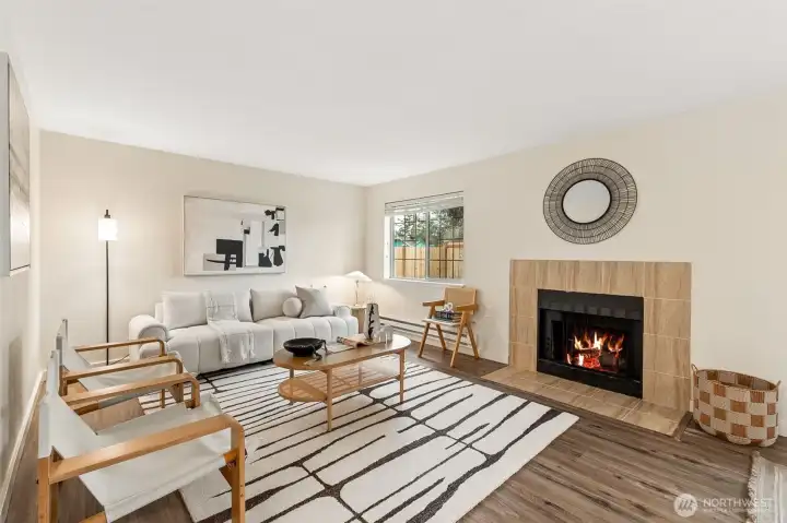 Wood fireplace anchoring the living room.