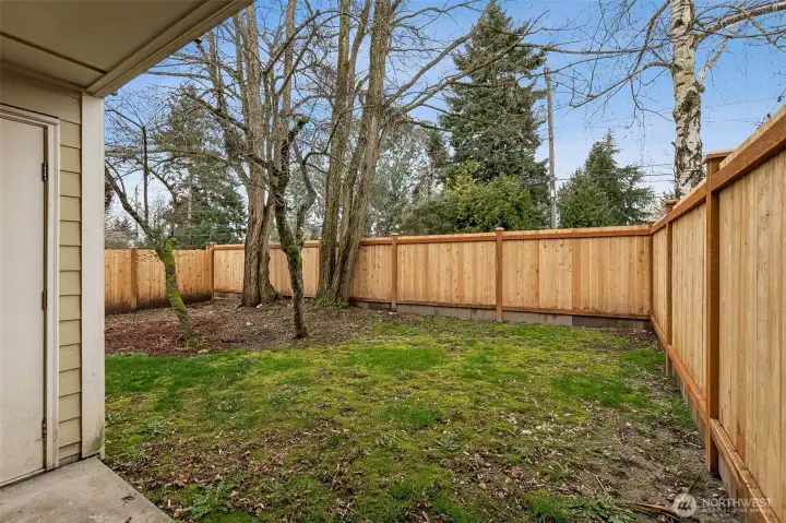 Private outdoor patio with storage locker.