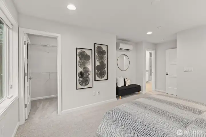 Primary bedroom with ensuite bathroom & walk-in closet (staged)