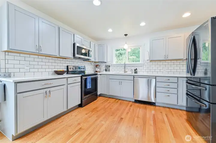 Sleek open kitchen that connects seamlessly to the main living area