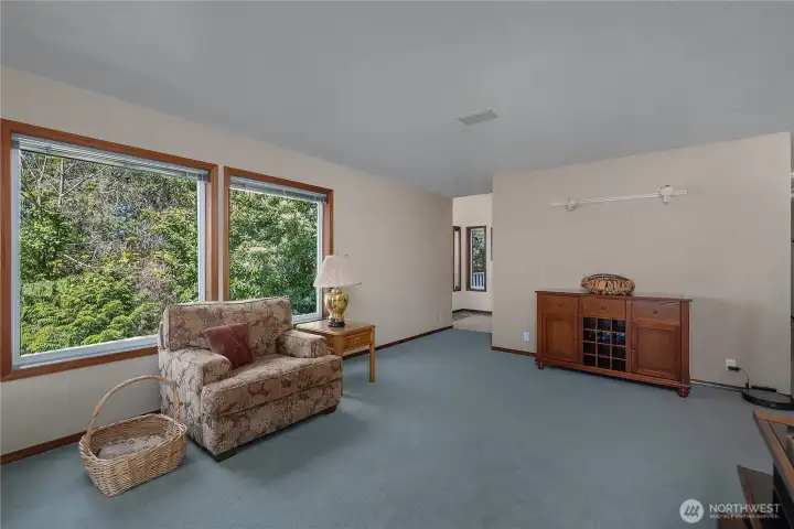 Spacious living room offers plenty of entertaining space with large windows and natural light. Spacious living room offers plenty of entertaining space with large windows and natural light.