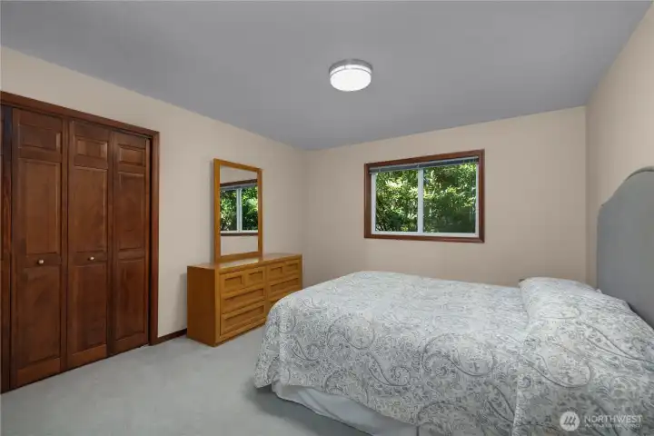 BR 3 - Another main floor bedroom features a peaceful setting, closet storage, and natural light. BR 3 - Another main floor bedroom features a peaceful setting, closet storage, and natural light.