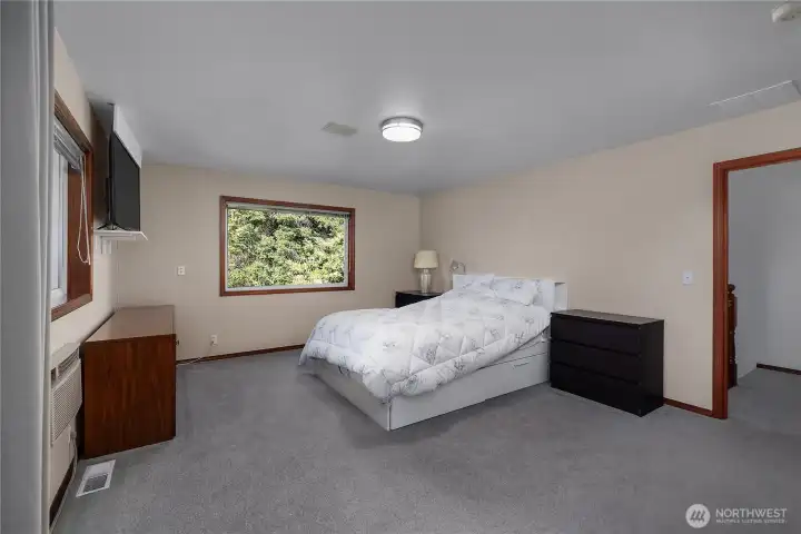 Primary Suite - Spacious primary bedroom offers room for a sitting area and private retreat feel. Primary Suite - Spacious primary bedroom offers room for a sitting area and private retreat feel.