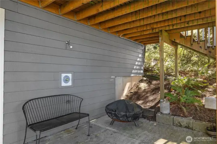 Convenient outdoor shower next to the spa in the covered lower patio area offers sheltered outdoor space beneath the deck. Convenient outdoor shower next to the spa in the covered lower patio area offers sheltered outdoor space beneath the deck.