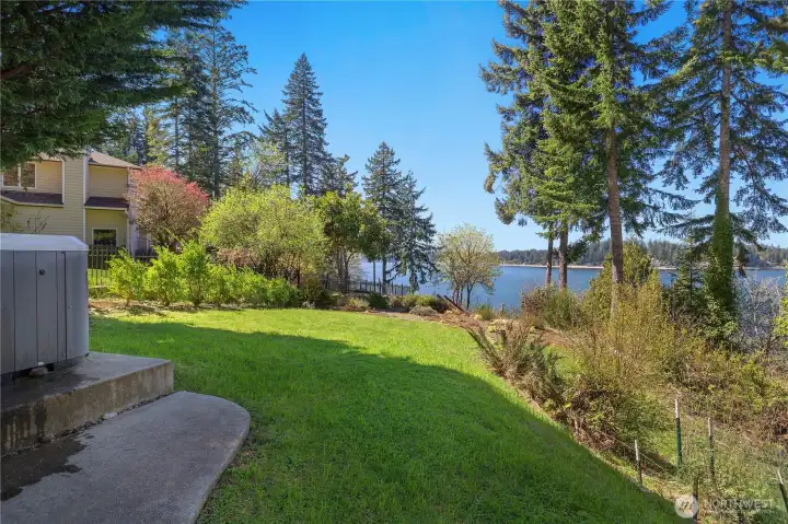 Enjoy the open yard and waterfront setting with room to relax and take in the view. Enjoy the open yard and waterfront setting with room to relax and take in the view.