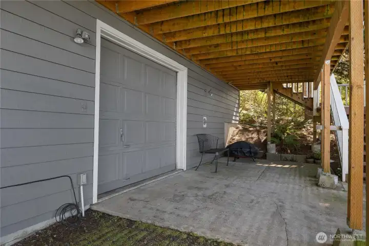 Covered lower-level patio space add flexibility and function. The convenient garage door allows for easy access to storage for your water toys! Covered lower-level patio space add flexibility and function. The convenient garage door allows for easy access to storage for your water toys!