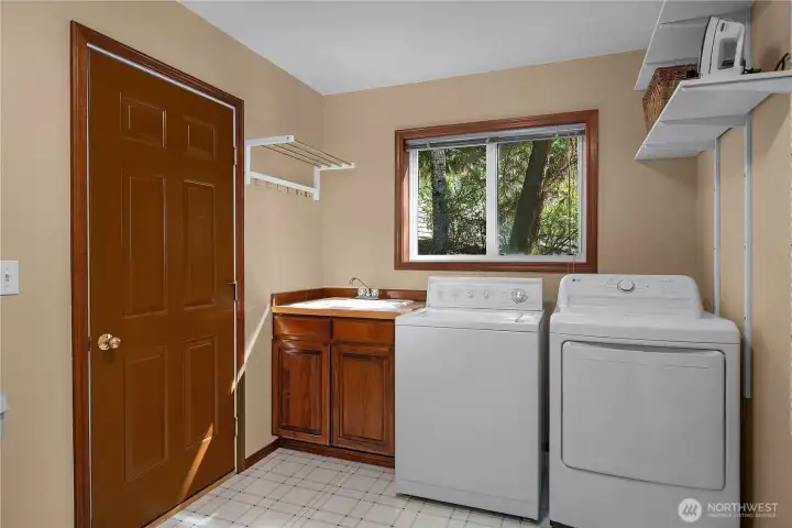 Main Floor Laundry/Mud room with 3/4 bath and direct access to the garage. Main Floor Laundry/Mud room with 3/4 bath and direct access to the garage.