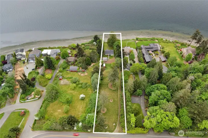 Drone overhead view of the acre+ showing the waterfront home set way off the road.