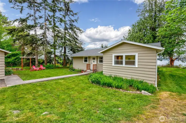 Parking area, garage and side yard.