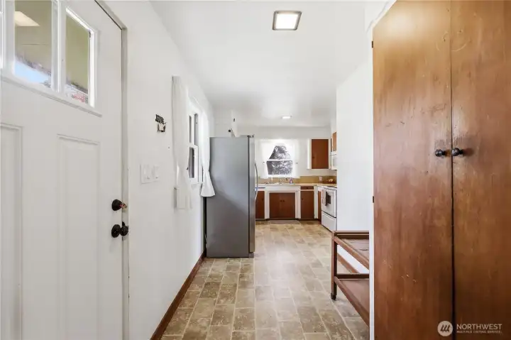 The main entrance from the back of the home. Built in storage closet to the right.