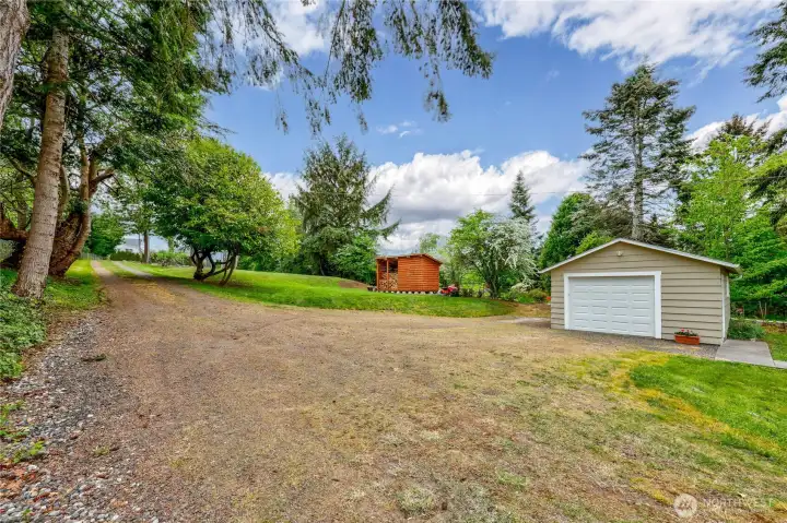 The single car garage with driveway back to the road.