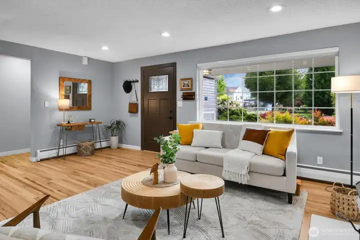 Spacious main living area with updated finishes, cozy fireplace, and open flow perfect for modern West Seattle living.