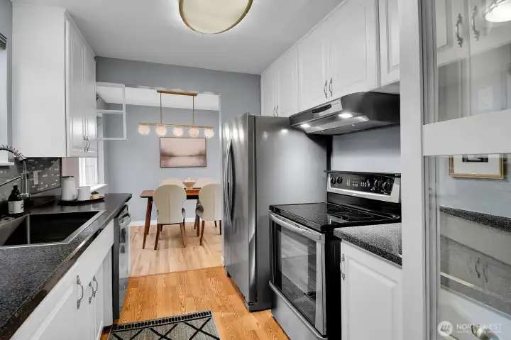 Remodeled kitchen with quartz-style counters, stainless appliances, and functional layout perfect for everyday living.