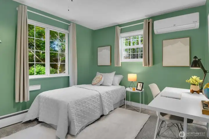 Versatile third bedroom ideal for guests, nursery, or home office with bright windows and updated finishes.