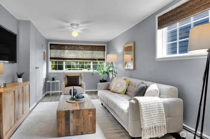 Cozy bonus living space or media room with natural light and flexible layout for work, play, or relaxing evenings