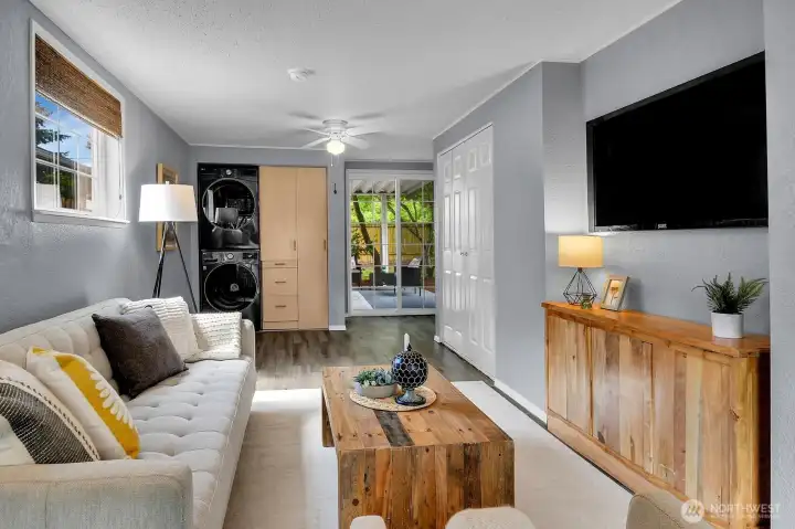 Secondary living area with contemporary styling and indoor-outdoor flow overlooking beautifully landscaped backyard.