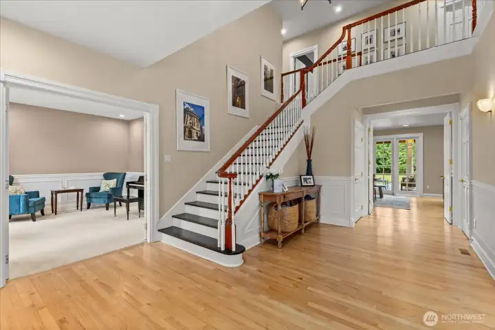 Grand entry with soaring ceilings creates a stunning first impression