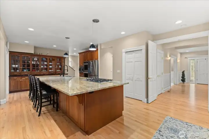 Chef-inspired kitchen featuring a 15-foot island, double ovens, and gas range