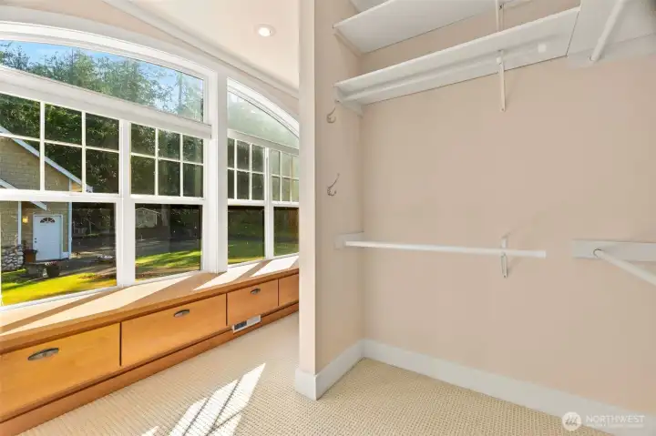 primary room walk-in closet w storage and seating primary room walk-in closet w storage and seating