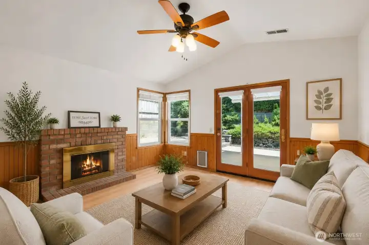 Family room features many windows and French Doors. Staged for decorsating ideas.