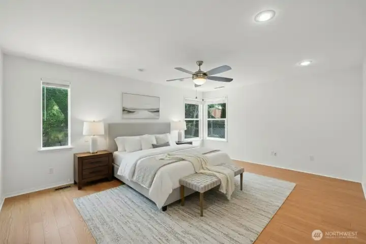 Primary bedroom is located in the back corner. Virtually staged.