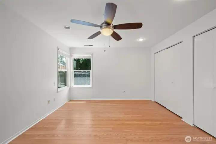 Primary bedroom with private backyard views.