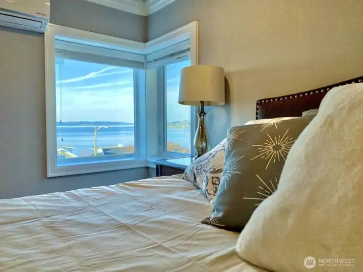 Unit A primary bedroom with water views