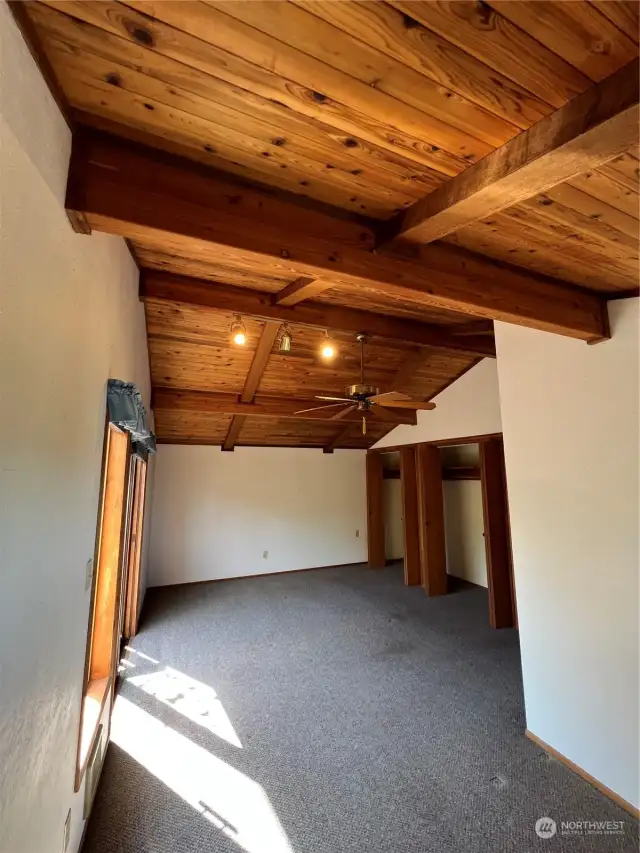 Large Primary Bedroom with wonderful wood ceilings and double closest.
