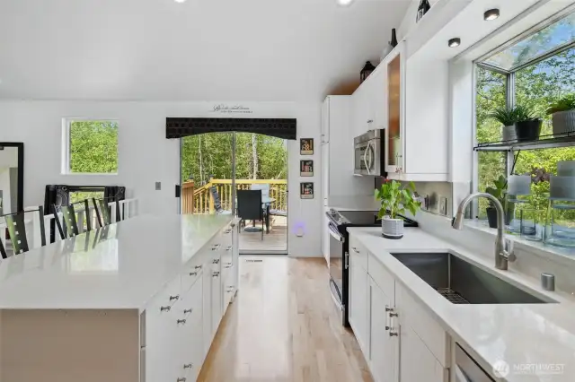 Kitchen flows out to a large deck