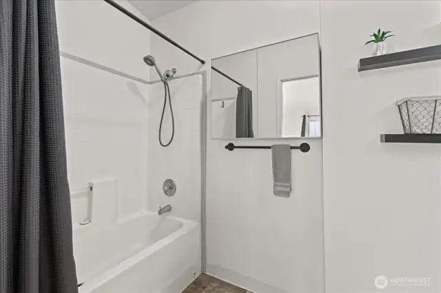 Primary Bathroom, vanity and toilet behind the door to the right.