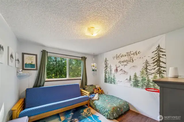 The second bedroom enjoys cheery light when the afternoon sun from the West greets the front of the home.    A great space for play, no matter the age of the occupant!  Toys or hobbies welcome!