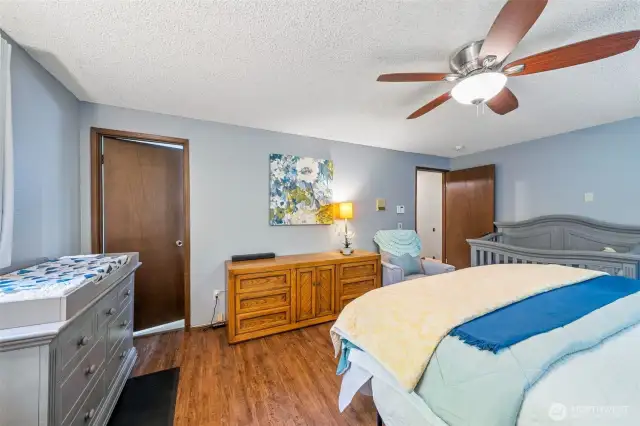 A view from the corner of the primary shows the flexible space with plenty of art or photo walls waiting for your special moments and cherished displays.