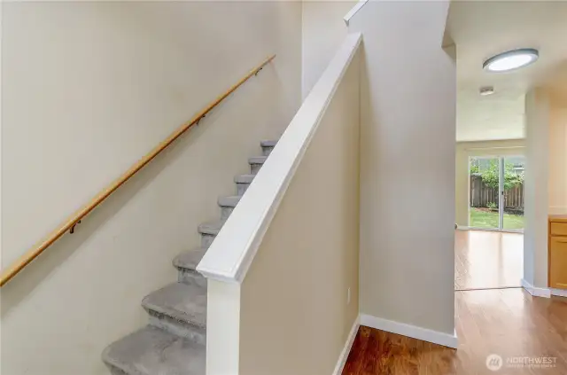 All hard surfaces on the main floor with carpeted stairs and bedrooms upstairs.