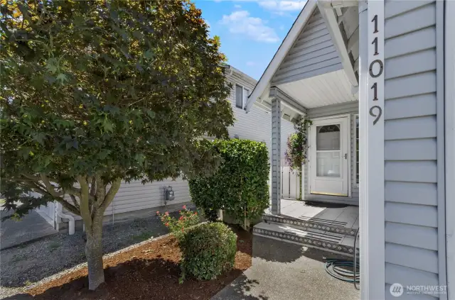 Strategic trees and shrubs provide privacy. Vinyl siding means low or no maintenance!