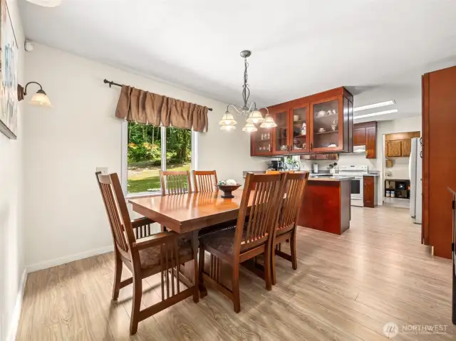This view shows the Dining Room and you also see the Kitchen and Laundry Room. Lots of counter & cabinet space, plus huge mud room off carport entry gives plenty of extra storage!