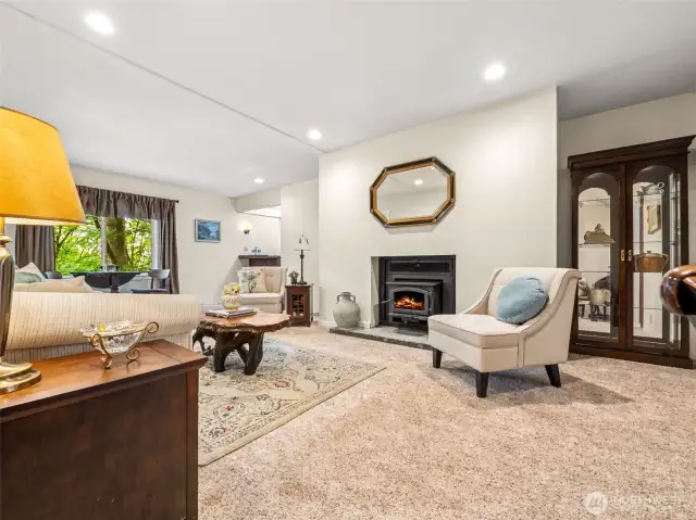 Additional space in the Living Room, complete with cozy wood-burning stove and wetbar -- this is a home made for entertaining!