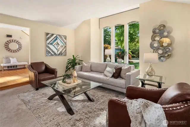 Step into the light-filled, spacious living room... with new carpeting throughout.