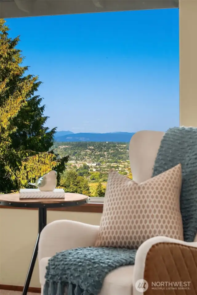 Serene sitting area overlooks the back yard and onto the foothills.